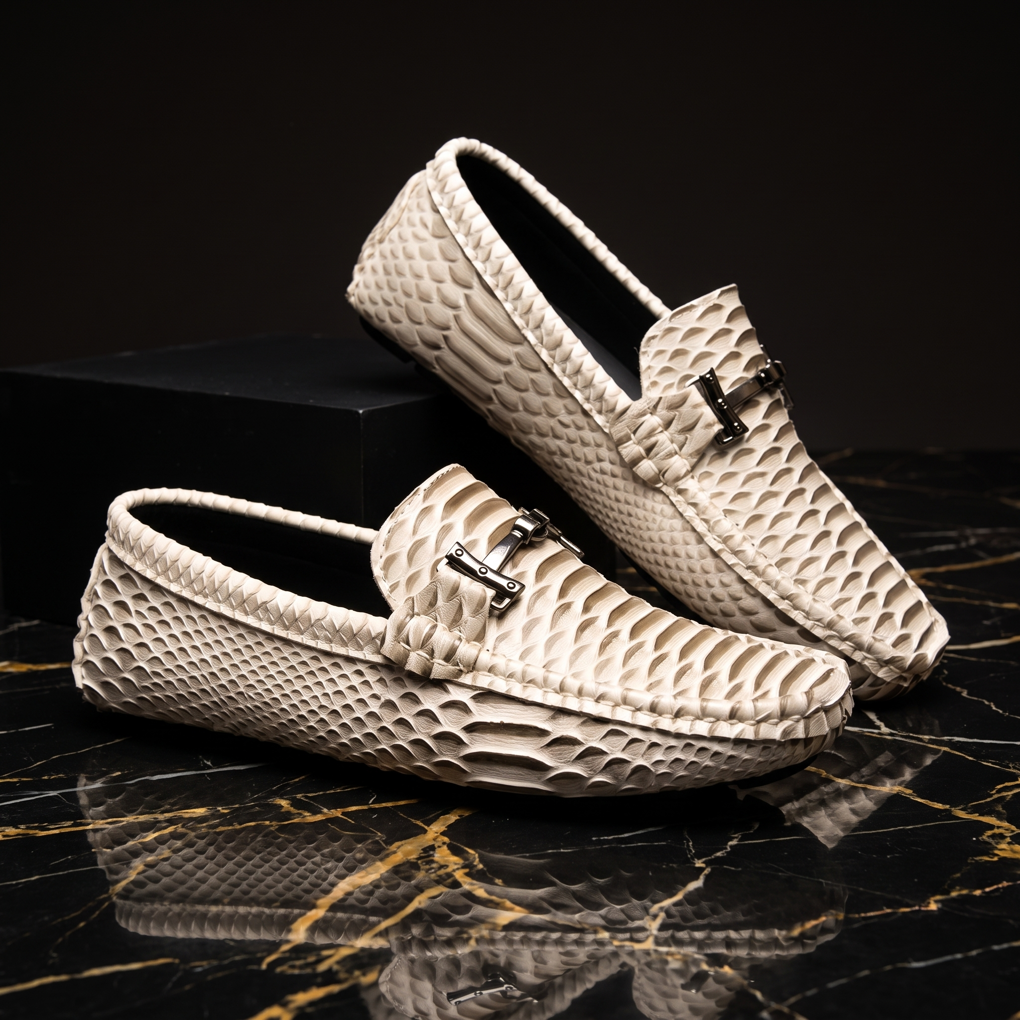 Textured loafer with metal buckle and moc toe