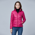 Women's quilted puffer jacket with high collar, long sleeves and front zip