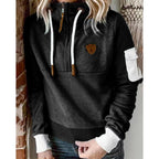 Women's hooded half-zip sweatshirt with long sleeves and utility sleeve pocket