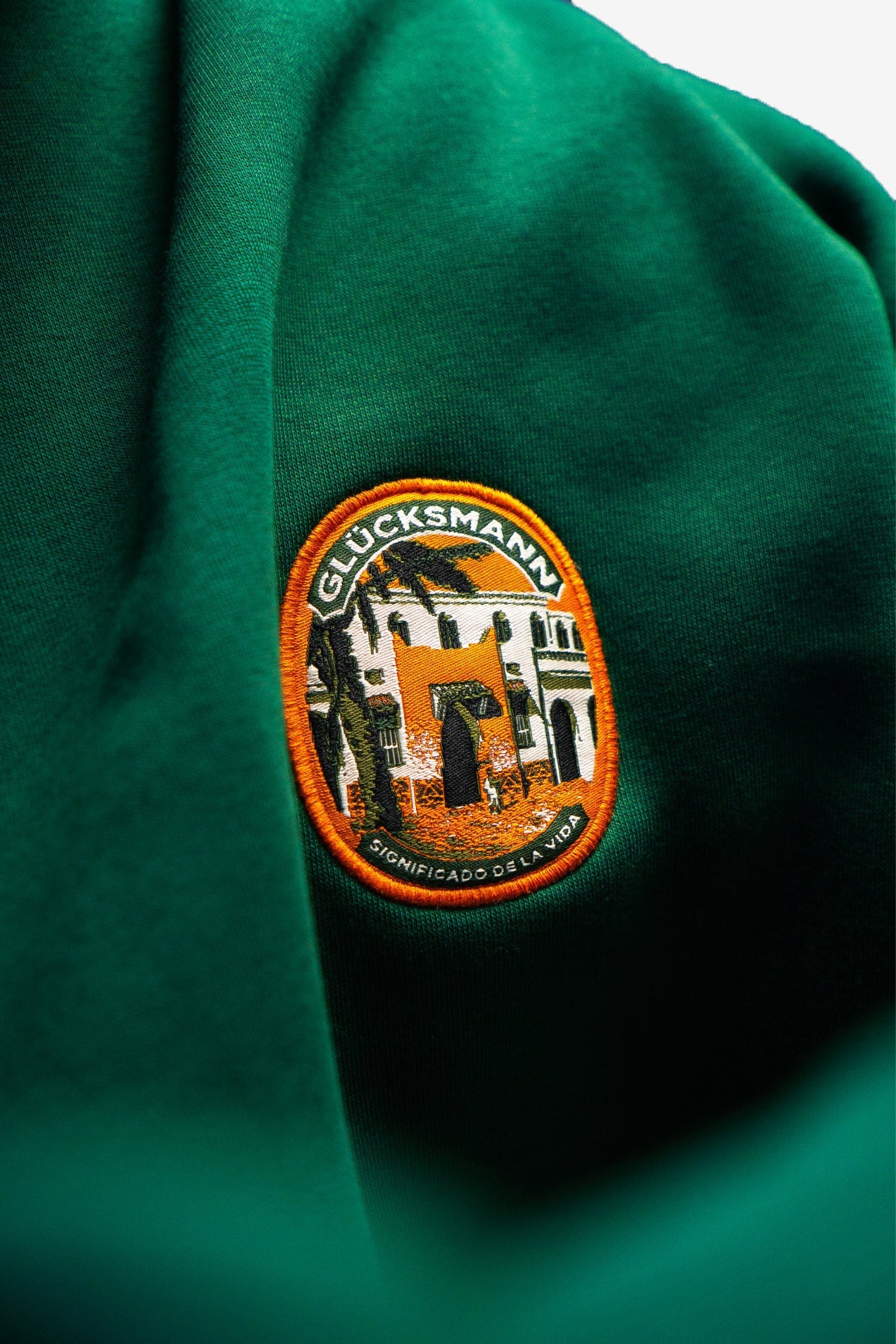 Men's green hoodie with graphic print, hood and kangaroo pocket