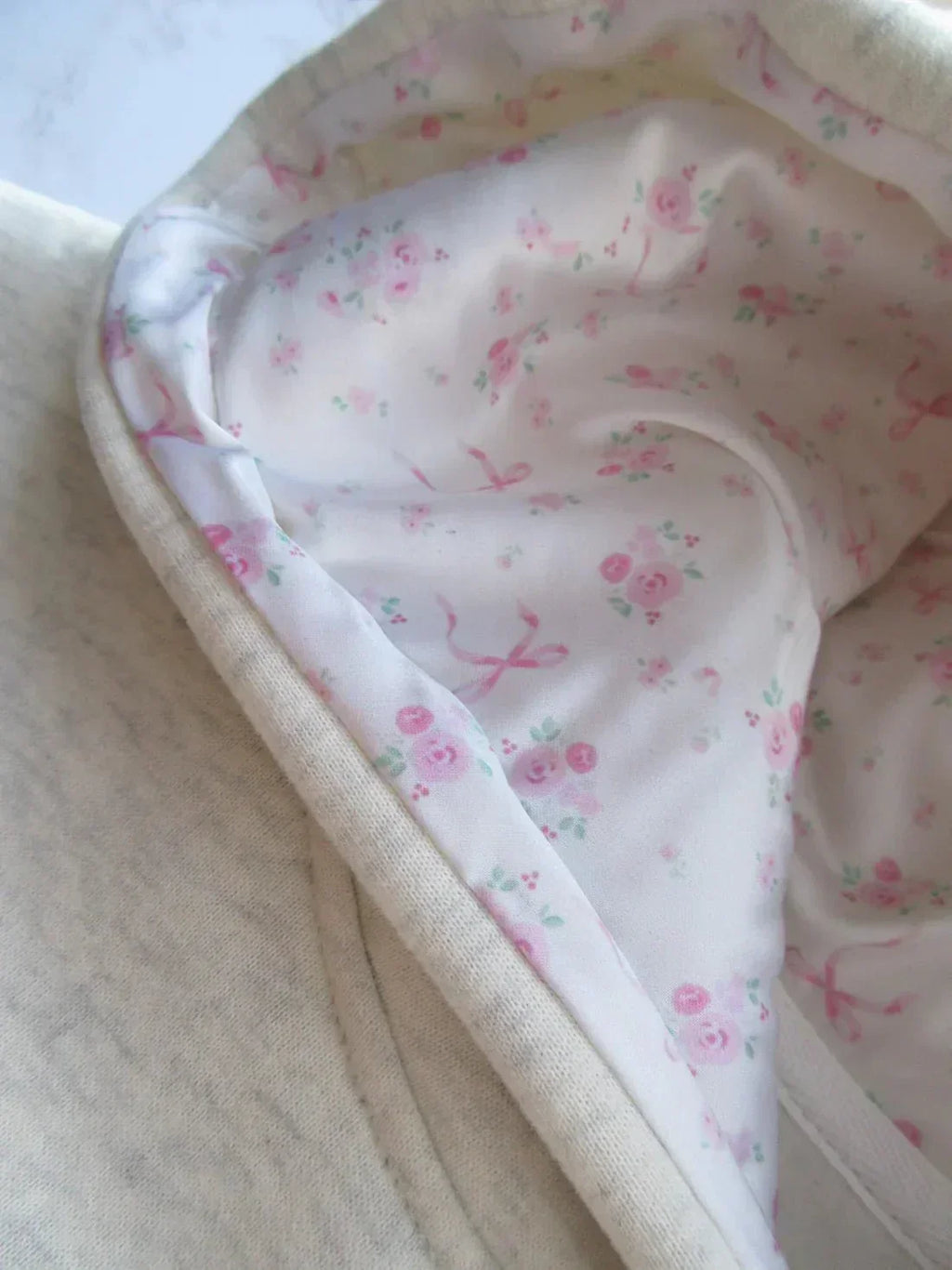 Women's cream grey hooded sweatshirt with pink bow detail
