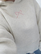 Women's cream grey hooded sweatshirt with pink bow detail