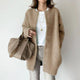 Women's long button cardigan with round neckline and long sleeves