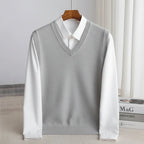 Men's V-neck knitted sweater vest layered over a white shirt
