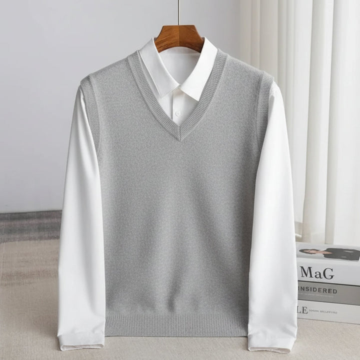 Men's V-neck knitted sweater vest layered over a white shirt
