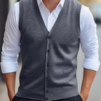 Men's sleeveless V-neck knit vest with button front and welt pockets