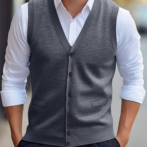 Men's sleeveless V-neck knit vest with button front and welt pockets