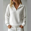 Women's quilted half-zip sweatshirt with high collar and long sleeves