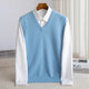 Men's V-neck knitted sweater vest layered over a white shirt