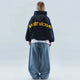 Oversized pullover hoodie with hood, long sleeves and contrasting text graphic on the back