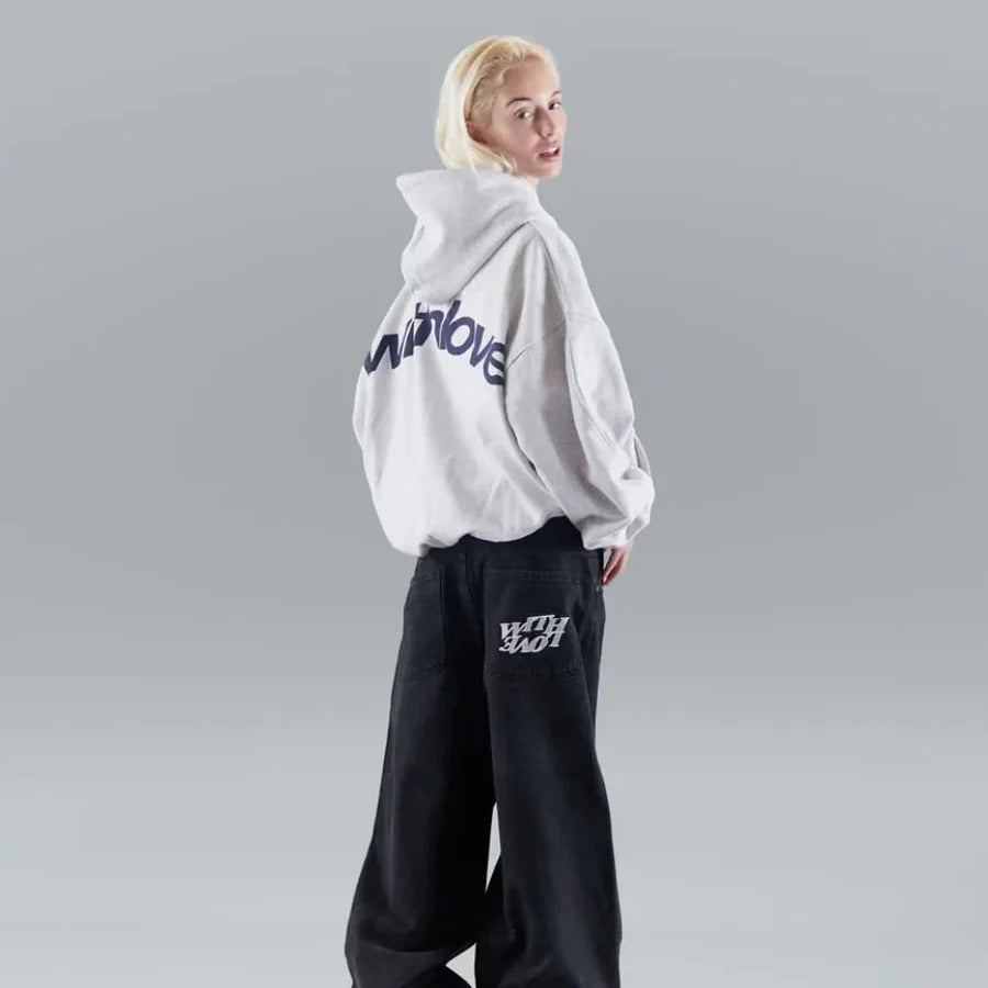 Oversized pullover hoodie with hood, long sleeves and contrasting text graphic on the back