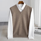 Men's V-neck knitted sweater vest layered over a white shirt