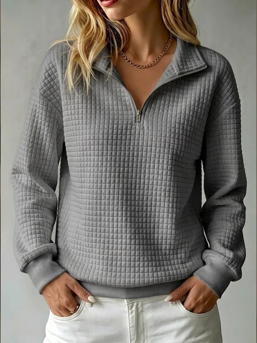 Women's quilted half-zip sweatshirt with high collar and long sleeves