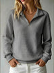 Women's quilted half-zip sweatshirt with high collar and long sleeves