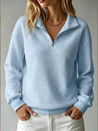 Women's quilted half-zip sweatshirt with high collar and long sleeves