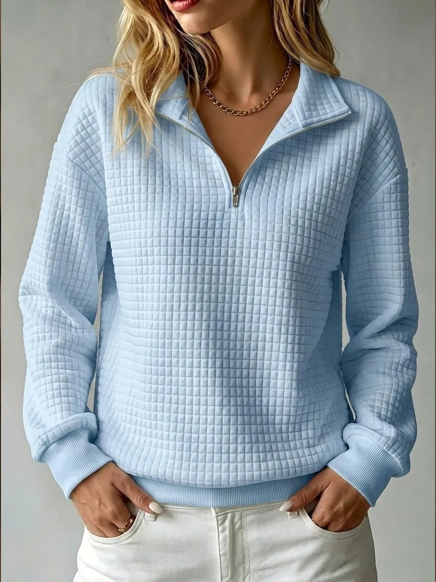 Women's quilted half-zip sweatshirt with high collar and long sleeves