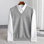 Men's V-neck knitted sweater vest layered over a white shirt