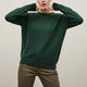 Women's long sleeve crew neck sweater with button details