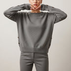 Women's long sleeve crew neck sweater with button details