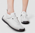 Women's strap sneakers with lace-up fronts and stitched soles