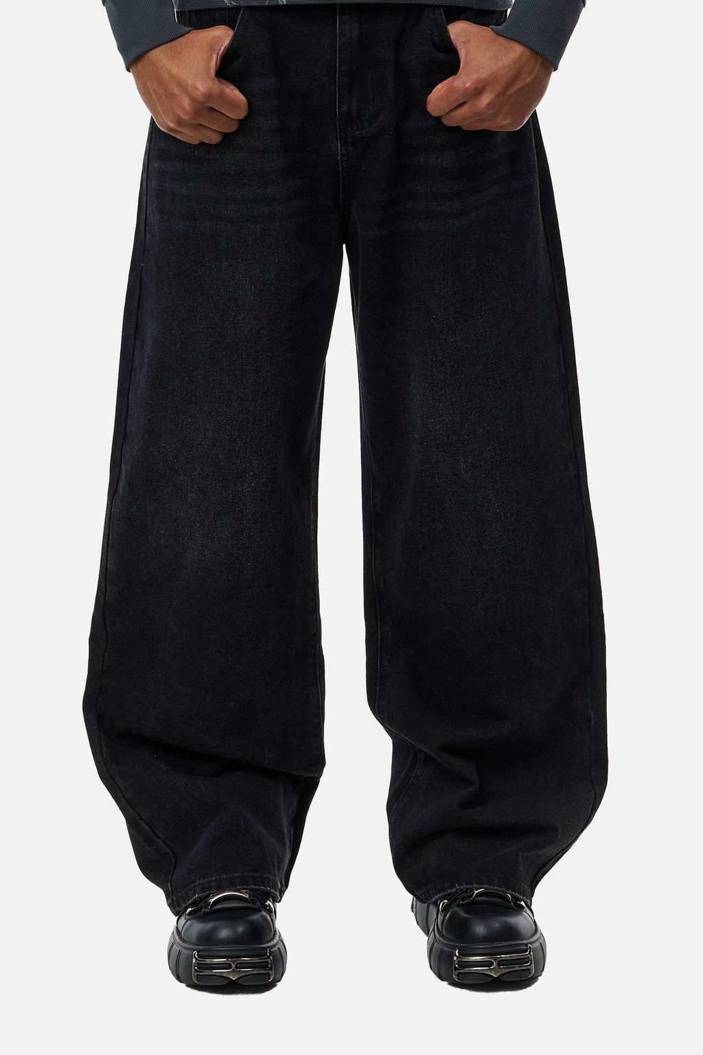 Men's black wide-leg jeans with graphic back pockets and gathered hems