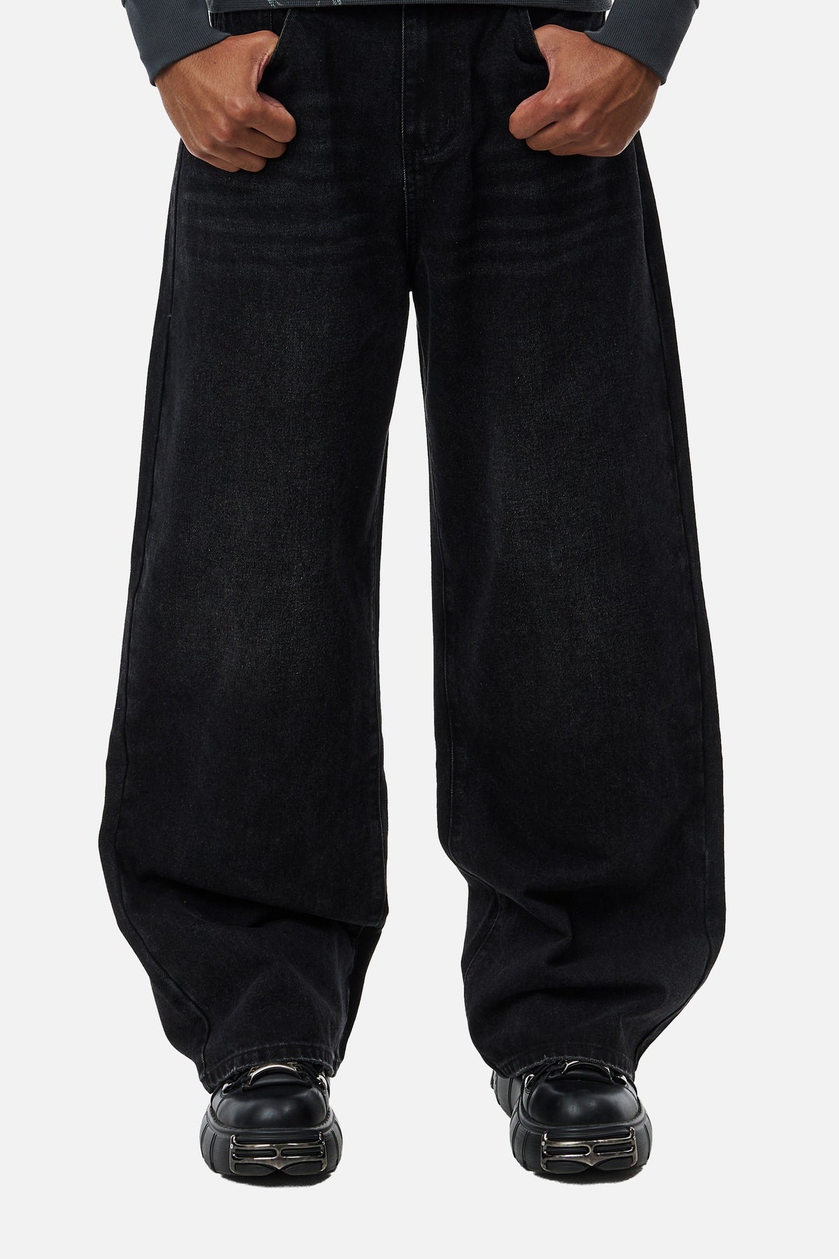 Men's black wide-leg jeans with graphic back pockets and gathered hems