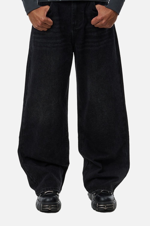 Men's black wide-leg jeans with graphic back pockets and gathered hems