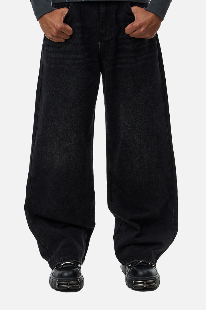 Men's black wide-leg jeans with graphic back pockets and gathered hems