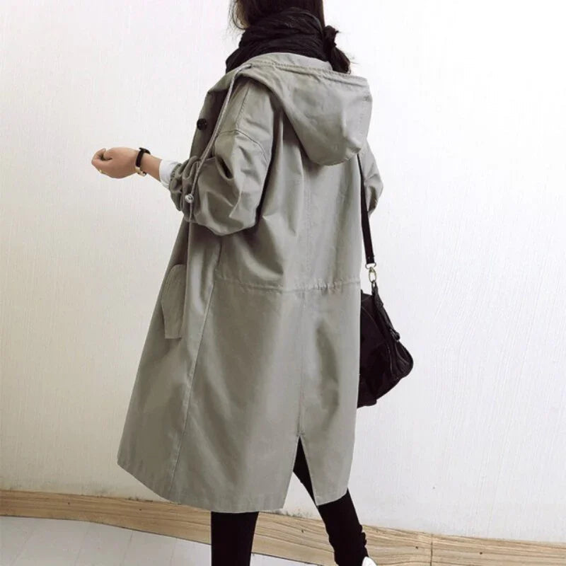Women's hooded trench coat with button front and angled pockets