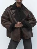 Women's brown oversized aviator jacket with wide dark collar and textured cuffs