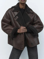 Women's brown oversized aviator jacket with wide dark collar and textured cuffs