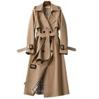 Women's long belted double-breasted trench coat with notched lapels and buckle cuffs