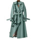 Women's long belted double-breasted trench coat with notched lapels and buckle cuffs