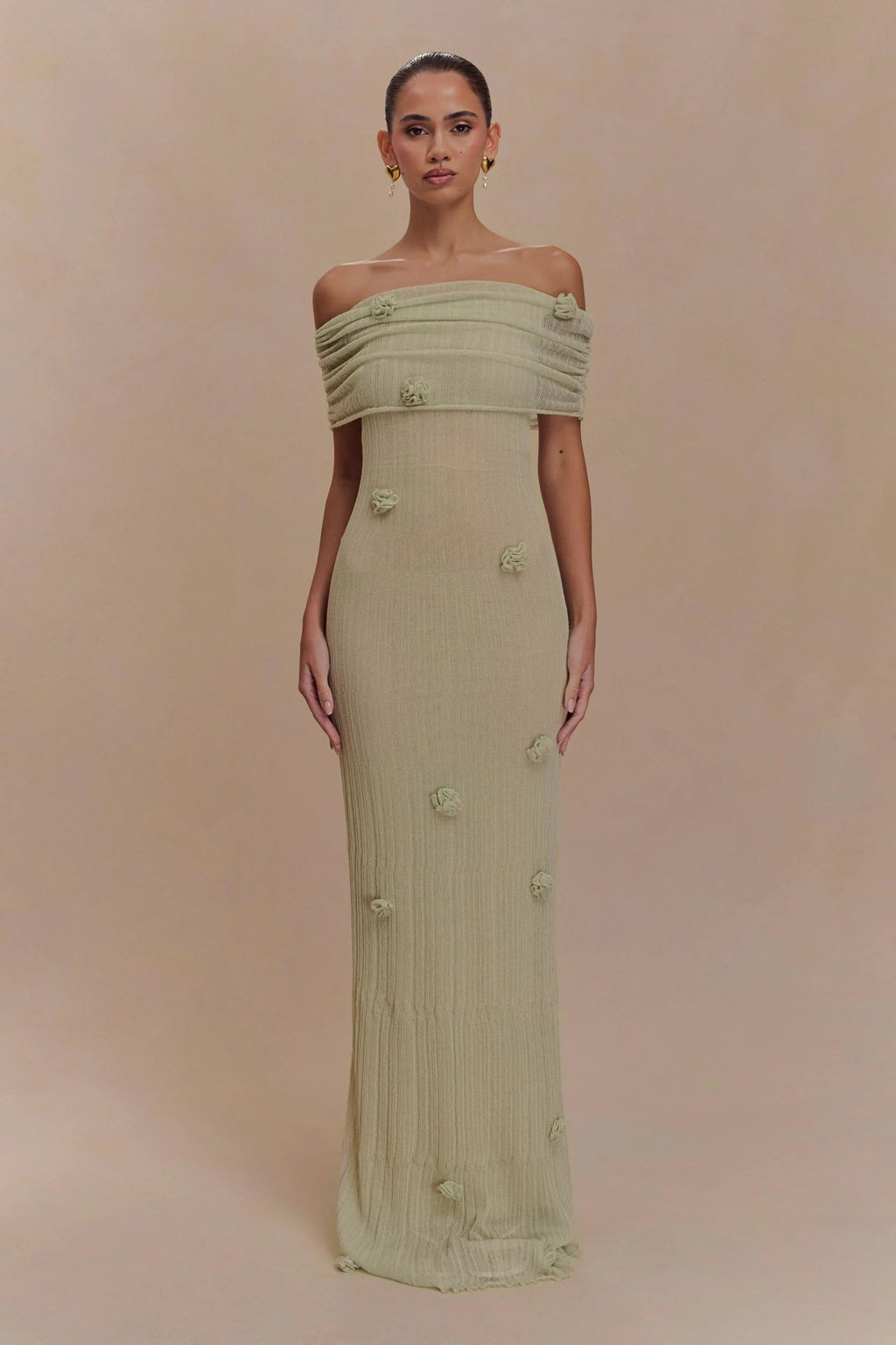Women's off-shoulder knit maxi dress with decorative rosettes