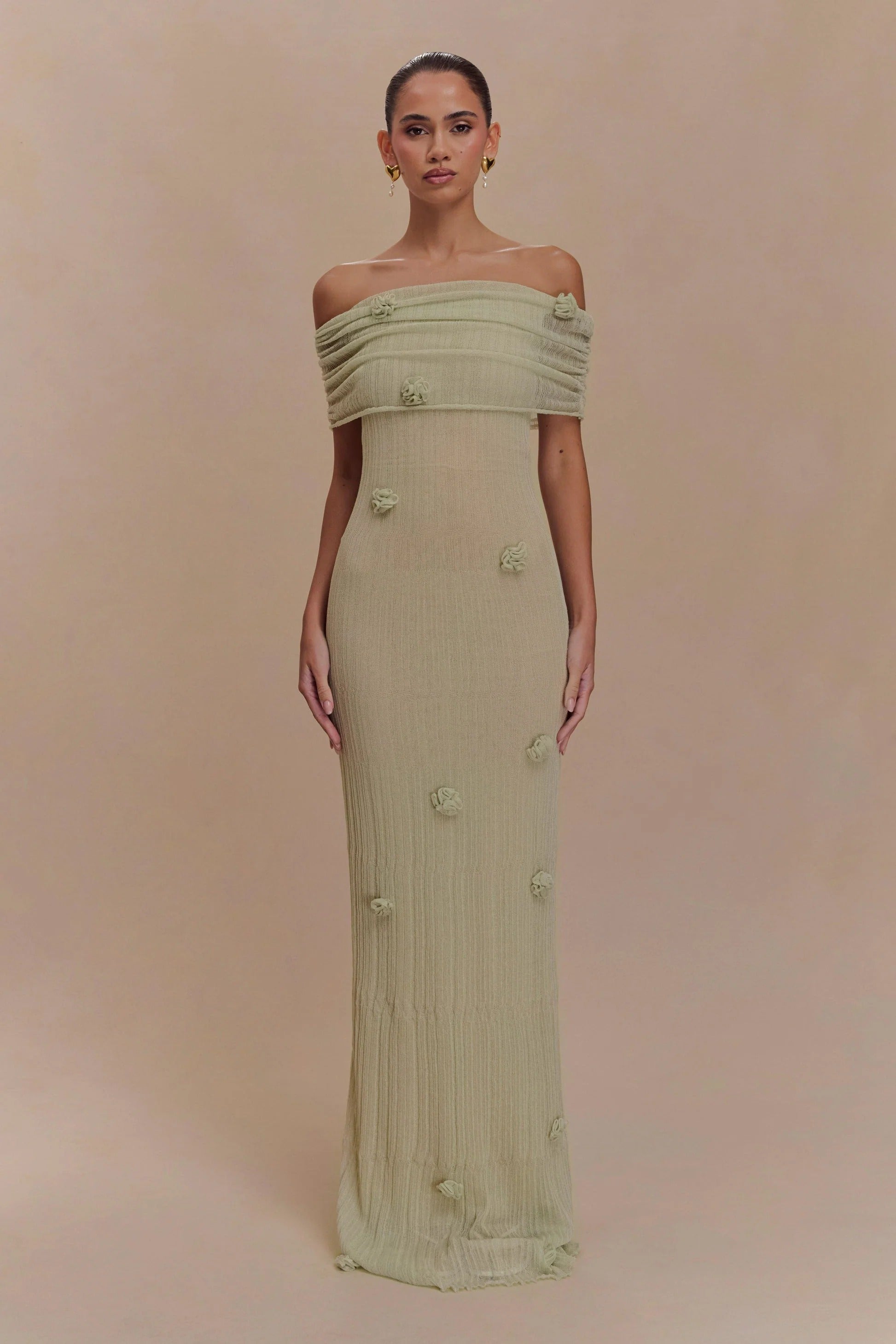 Women's off-shoulder knit maxi dress with decorative rosettes