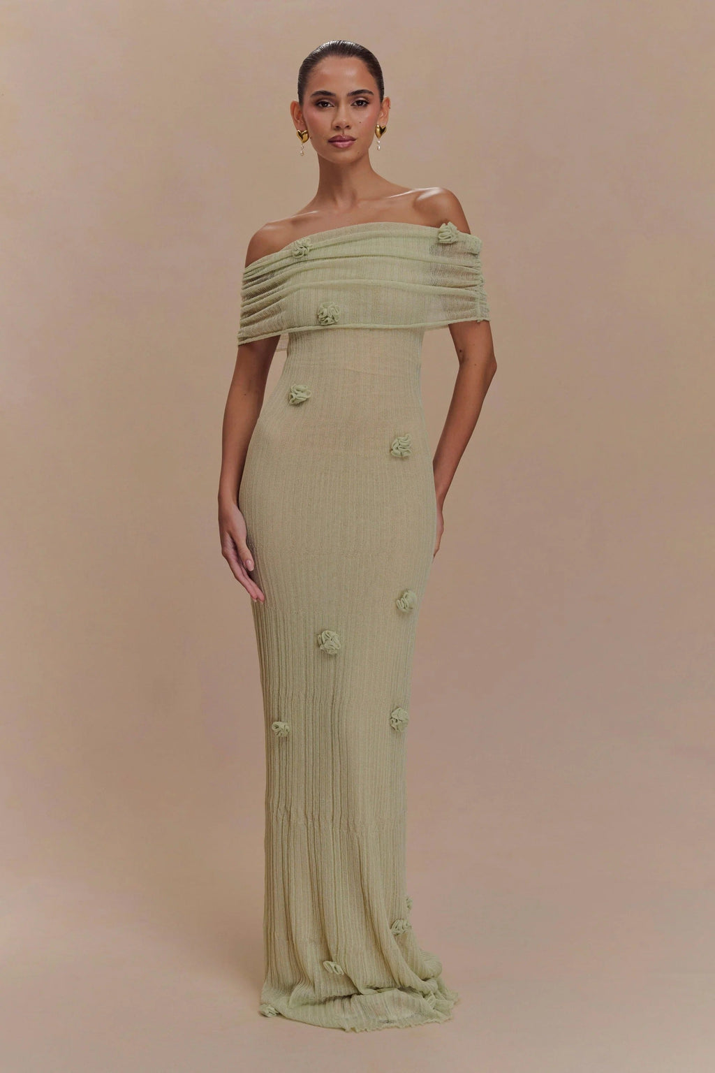 Women's off-shoulder knit maxi dress with decorative rosettes
