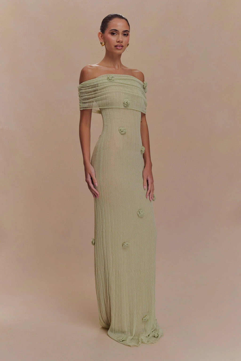 Women's off-shoulder knit maxi dress with decorative rosettes