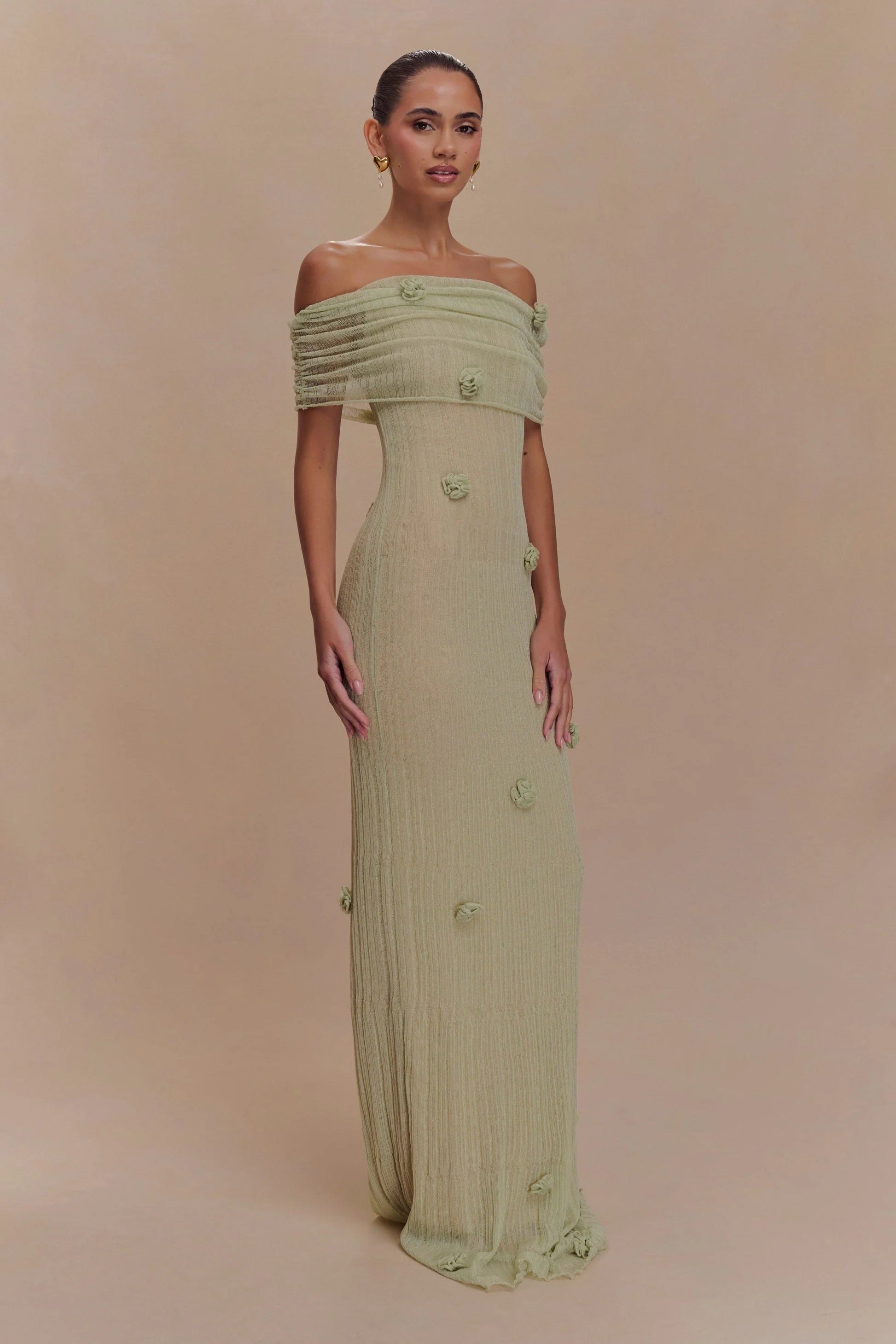 Women's off-shoulder knit maxi dress with decorative rosettes