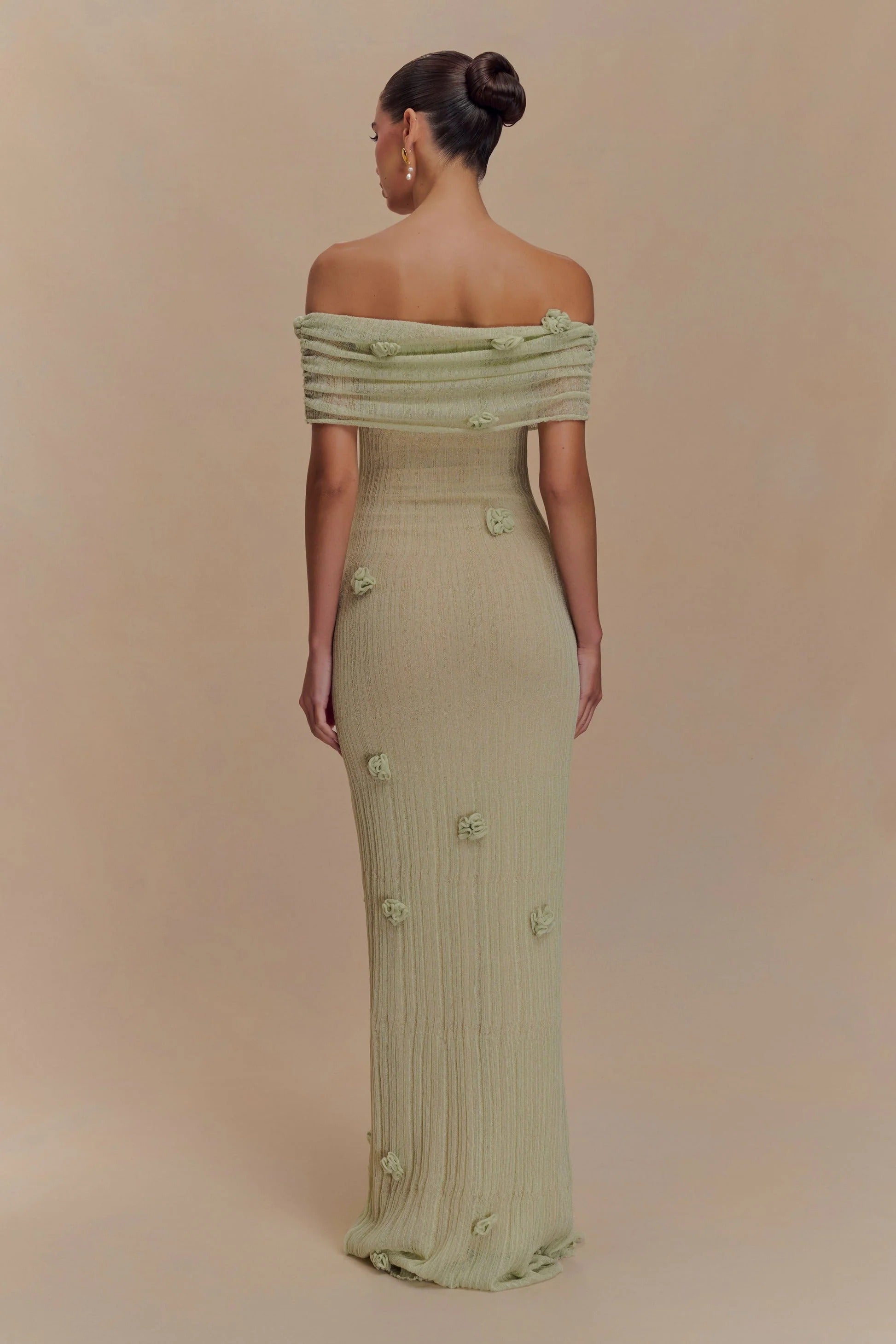 Women's off-shoulder knit maxi dress with decorative rosettes