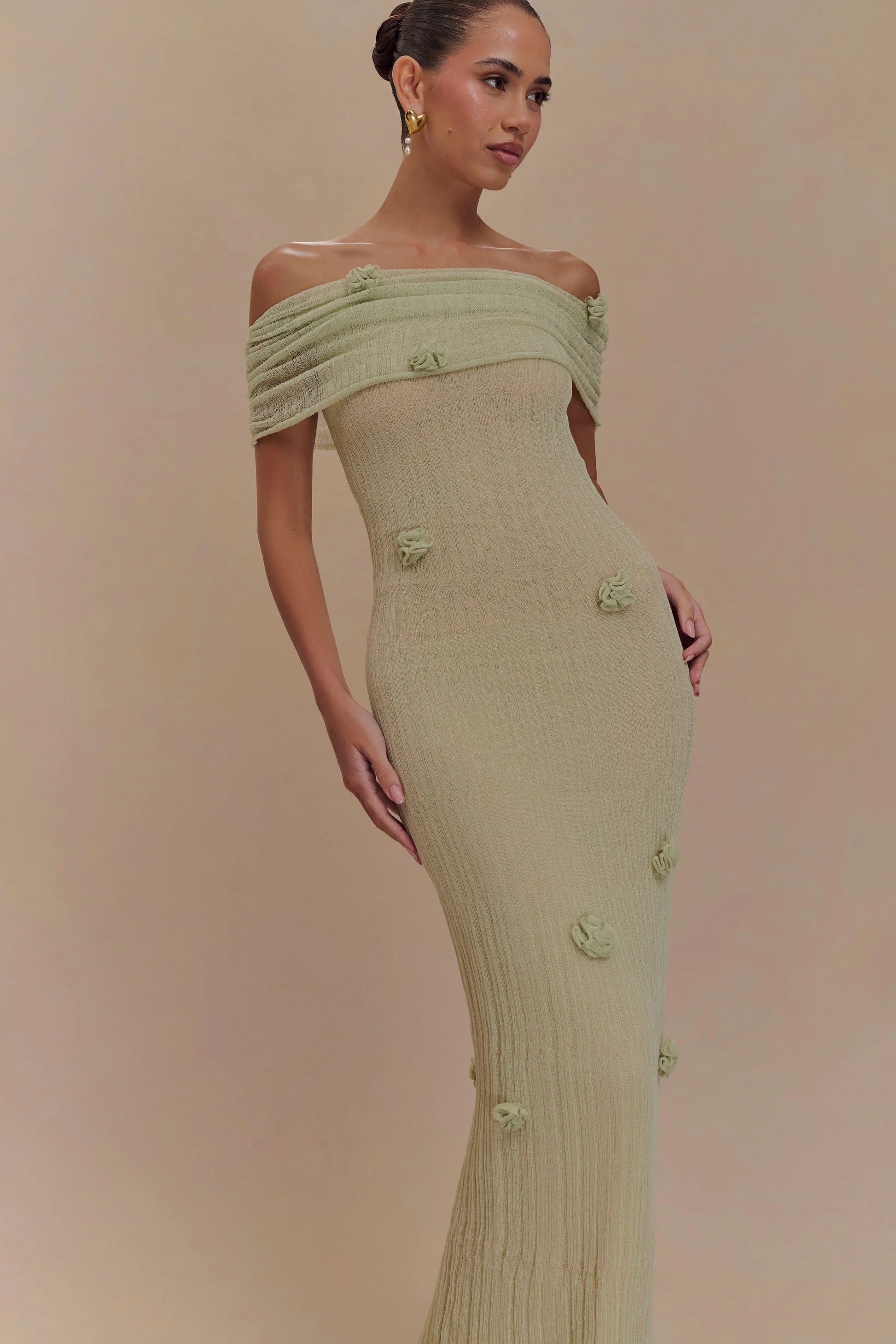 Women's off-shoulder knit maxi dress with decorative rosettes