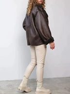 Women's brown oversized aviator jacket with wide dark collar and textured cuffs