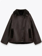 Women's brown oversized aviator jacket with wide dark collar and textured cuffs