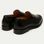 Men's black glossy horsebit loafers with round toe