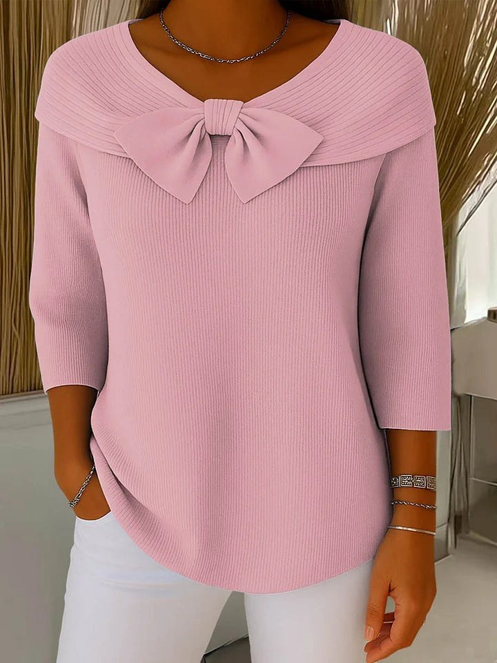 Women's ribbed sweater with a large bow and three-quarter sleeves