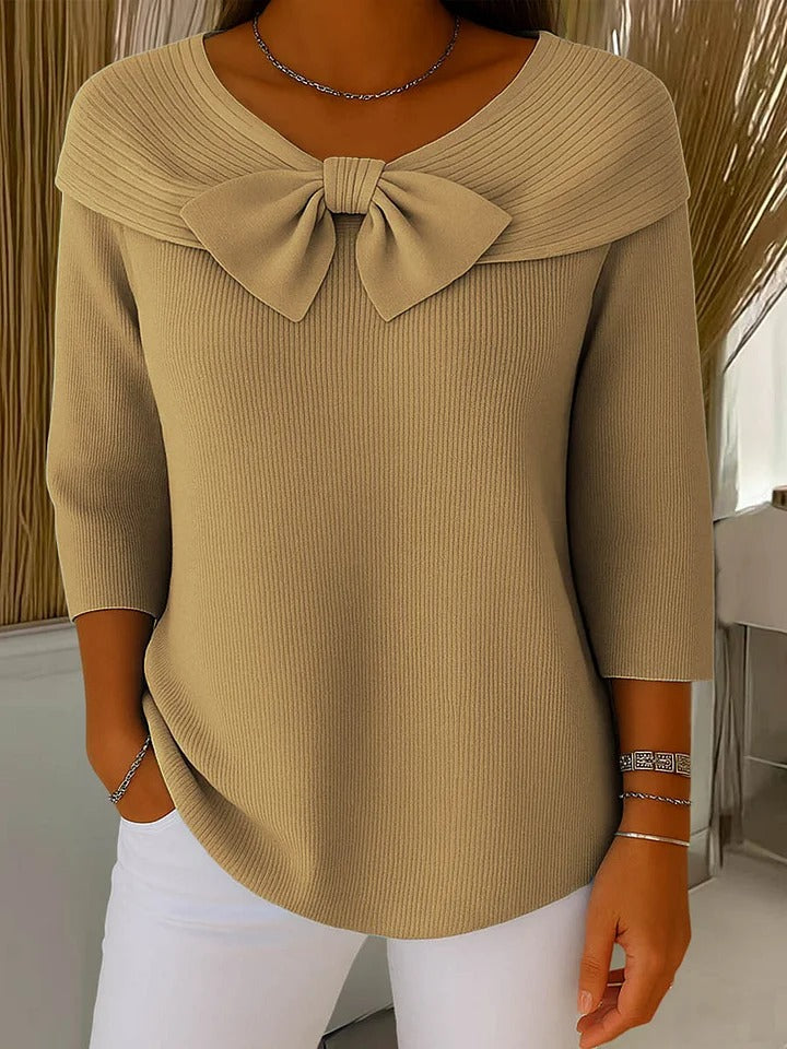 Women's ribbed sweater with a large bow and three-quarter sleeves