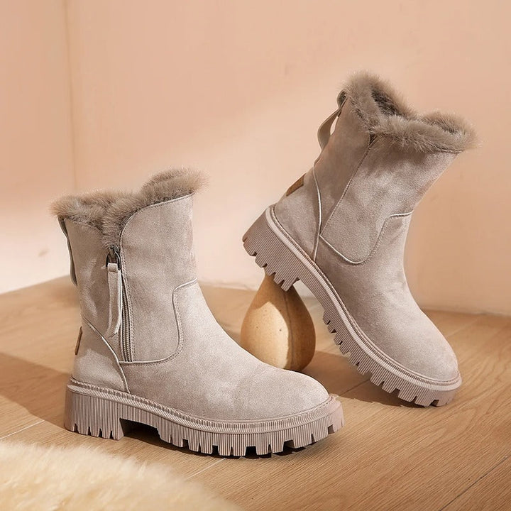 Fur-trimmed winter boots with side zipper and lug sole