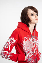 Women's red cropped hoodie with white and grey graphic print, hood and zip front