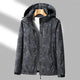 Women's hooded leaf pattern rain jacket with long sleeves and zipped pockets