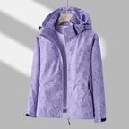 Women's hooded leaf pattern rain jacket with long sleeves and zipped pockets