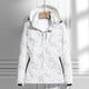 Women's hooded leaf pattern rain jacket with long sleeves and zipped pockets